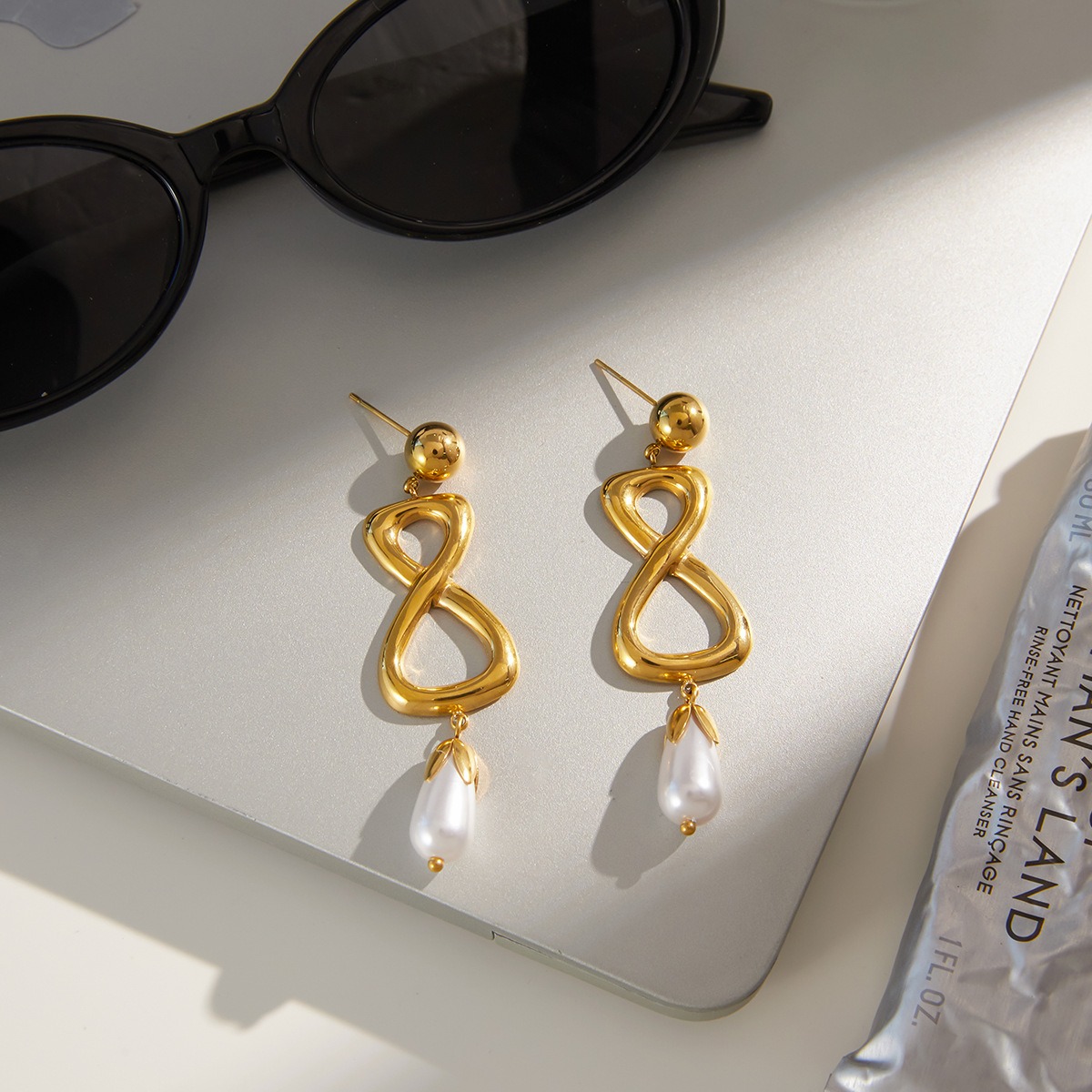 18K gold figure-eight shaped titanium steel earrings for autumn and winter. - Image 3
