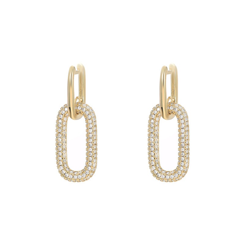 18K gold oval hoop earrings with cubic zirconia.