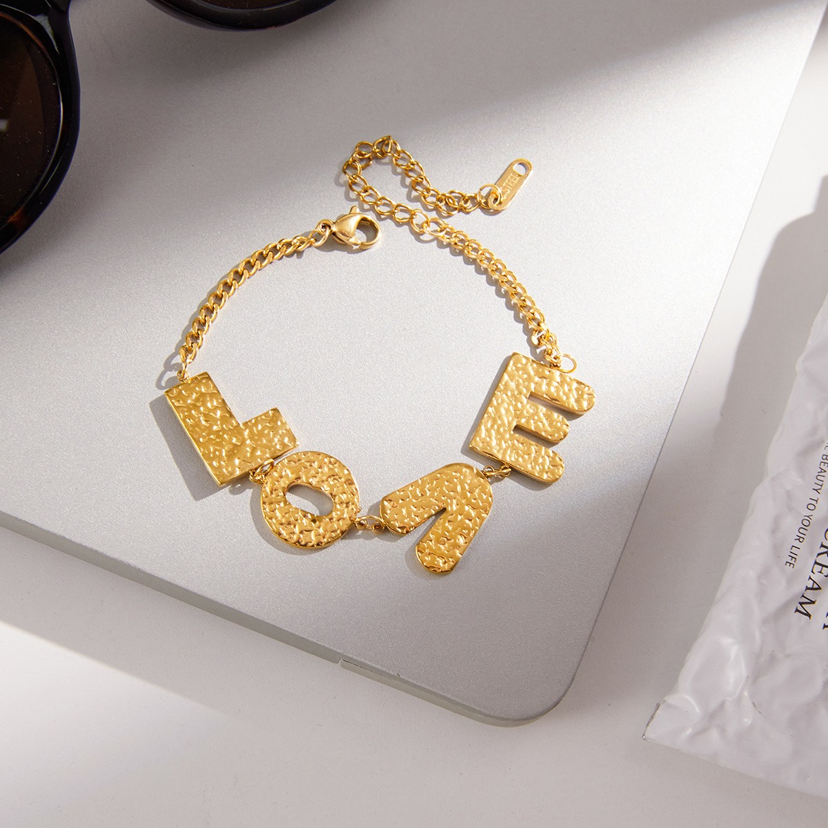 18K gold-plated, lightweight, and luxurious titanium steel bracelet with letter design. - Image 2
