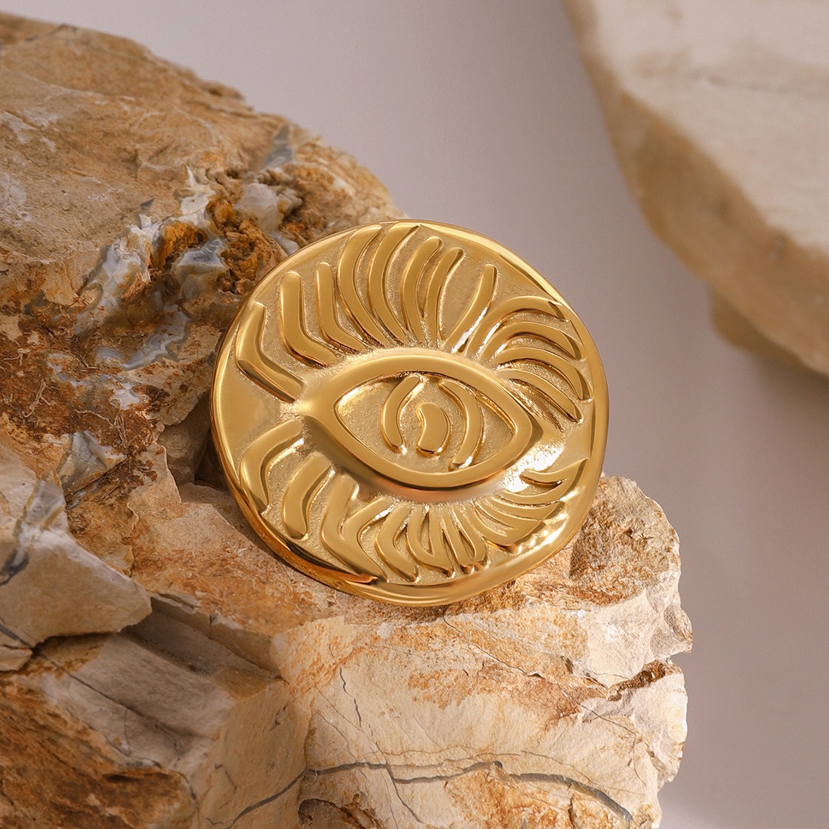18K gold devil's eye with texture design light luxury unique brooch