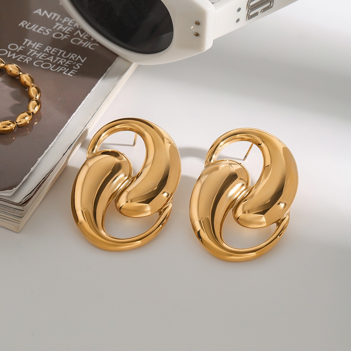 18K gold double teardrop-shaped earrings with hollow design, unique personality