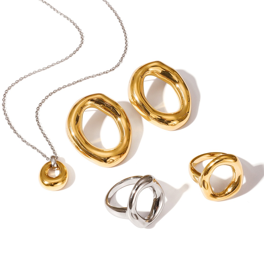 18K gold plated titanium steel necklace, earrings, and hoop earrings.